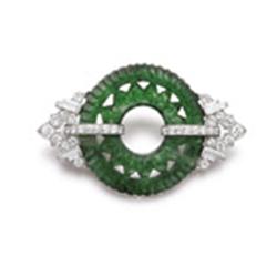 YARD AN ART DECO JADEITE AND DIAMOND PIN BROOCH Designed as a carved jadeite hoop, of fine emeral...