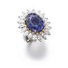 Image 1 : AN UNUSUAL COLOR CHANGE SAPPHIRE, DIAMOND AND YELLOW DIAMOND RING The oval-shaped color change sa...