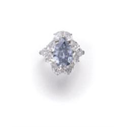 AN IMPORTANT FANCY DARK BLUISH GRAY DIAMOND RING The fancy dark bluish gray pear-shaped diamond w...