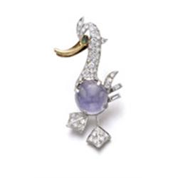 CARTIER A SAPPHIRE, DIAMOND AND EMERALD BROOCH Modeled as a duck, the body set with a circular-sh...