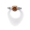 Image 1 : A FANCY DEEP YELLOWISH ORANGE DIAMOND RING The fancy yellowish orange brilliant-cut diamond weigh...
