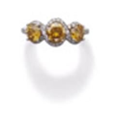 A FANCY VIVID YELLOW-ORANGE DIAMOND AND YELLOWISH-ORANGE DIAMOND RING The central fancy vivid yel...