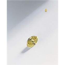 AN IMPORTANT FANCY VIVID YELLOW DIAMOND RING The fancy vivid yellow modified marquise-shaped diam...