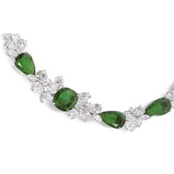 Property of a Lady A VERY FINE EMERALD AND DIAMOND NECKLACE The front set with a cushion-shaped e...