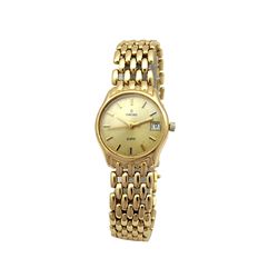 Lady's 14k Yellow Gold Concord Watch. Champagne Dial.