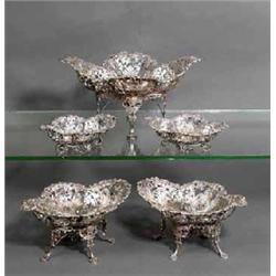 A TABLE GARNITURE, SHEFFIELD, 1898-1902, comprising a pierced shaped bowl with scroll and flowerh...