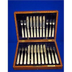 A CASED SET OF TWELVE FRUIT KNIVES AND TWELVE FORKS, SHEFFIELD, 1906, with mother-of-pearl handle...
