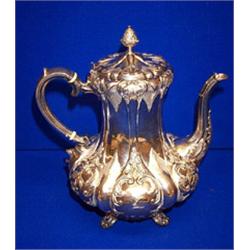 A COFFEE POT, SHEFFIELD, 1882, shaped lid with pineapple finial, the body embossed and raised on...