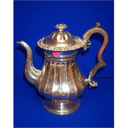 A pear SHAPED COFFEE POT, DUBLIN, 1829, WILLIAM NOLAN, with scroll spout and handle, rose finial<...