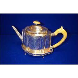 A BRIGHT CUT SHAPED OVAL TEAPOT, NEWCASTLE, c.1790, engraved with a monogram, with ivory finial a...