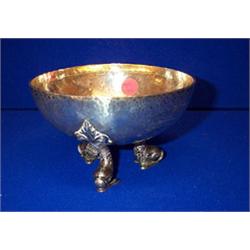 A HAMMERED BOWL, LONDON, 1907, on dolphin supports,, 15cms diameter....