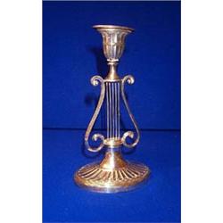 A CANDLESTICK, LONDON, 1900, with lyre stem and oval patera base....