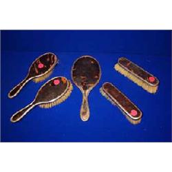 A TORTOISESHELL AND SILVER DRESSING TABLE SET, LONDON, 1924, (5)....