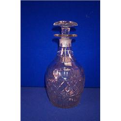 A SET OF THREE ONE PINT DECANTERS, IRISH, c.1830, three plain neck rings, simple facet cutting, f...