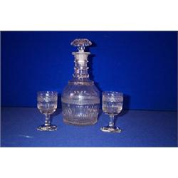A CUT DECANTER, EARLY 19th CENTURY, PROBABLY WATERFORD, four neck rings to shoulders and fluted b...