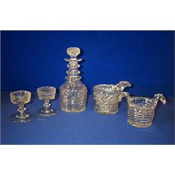 A COLLECTION OF DEEP CUT PRISMATIC GLASS, WATERFORD, 1820/30, comprising a three neck ring decant...