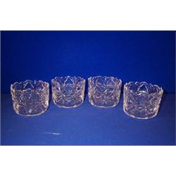 A GOOD SET OF FOUR FINGER BOWLS, c.1800, WATERFORD, with shaped rims, cut overall, 7cms diamete...