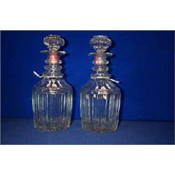 A GOOD PAIR OF CUT DECANTERS, WATERFORD, triple neck rings and fluted sides, star cut bases, prob...