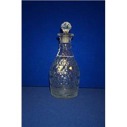 A SMALL CLUB SHAPED DECANTER, c.1800, flat cut, bands of diverse decoration and apparently with i...