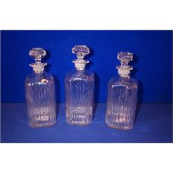 A SET OF MOULDED SQUARE SPIRIT DECANTERS, IRISH, EARLY 19th CENTURY, engraved "Gin", "Whiskey", "...