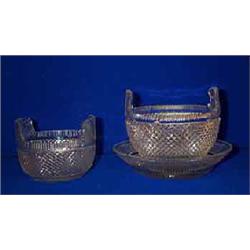 A FLANGED BUTTER BOWL, c.1840, fluted rim, cut overall with hob nails and raised on a star cut ba...