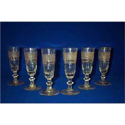 A SET OF SIX CHAMPAGNE FLUTES, WATERFORD, c.1840, with bands of diamond cutting above prisms and...