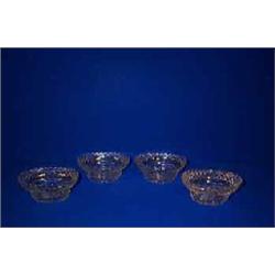 A SET OF FOUR OGEE SHAPED EPERGNE BOWLS, 19th CENTURY, with carved rims above bevel hob nails, ta...