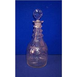 A MALLET SHAPED CUT DECANTER, c.1800, PROBABLY CORK, IN NEO-CLASSICAL STYLE, with three faceted n...