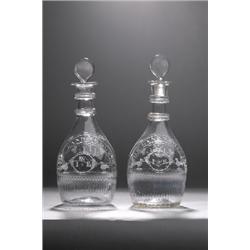 AN IMPORTANT AND POSSIBLY UNIQUE PAIR OF 'THE LAND WE LIVE IN' DECANTERS, cork, c.1800, ascribed...