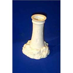A BELLEEK NIGHT LIGHT HOLDER, FIRST PERIOD, (1863-1890), in the form of a lighthouse on rocky bas...