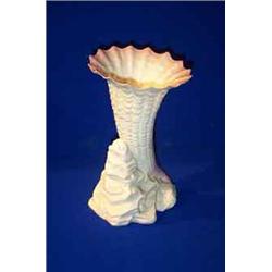 A BELLEEK LARGE "ROCK SPILL" VASE, FIRST PERIOD, (1863-1890), washed in pale pink, on a rocky bas...