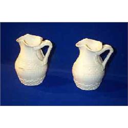 TWO MATCHING BELLEEK "HARP JUGS", FIRST PERIOD, (1863-1890), with double harp handles, the bodies...