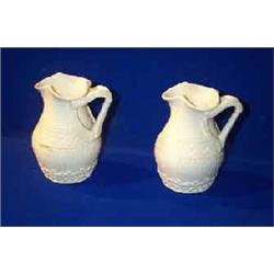 TWO MATCHING BELLEEK  HARP JUGS , FIRST PERIOD, (1863-1890), with double harp handles, the bodies...