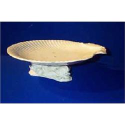 A BELLEEK SHELL COMPORT, on dolphin support and sea base, impressed BELLEEK, Co. FERMANAGH, 23c...