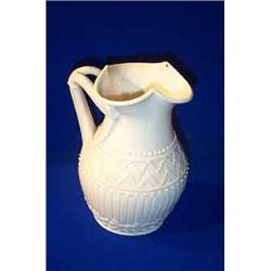 A BELLEEK "HARP JUG", FIRST PERIOD, (1863-1890), with double harp handle and the rim pierced in t...