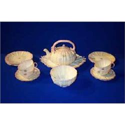 A BELLEEK "TRIDACNA" PART TEA SERVICE, FIRST PERIOD, (1863-1890), washed in pink bearing initials...