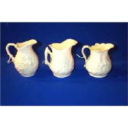 A BELLEEK SMALL IVY MILK JUG, FIRST PERIOD, (1863-1890), black printed mark, 9.5cms high; a Belle...