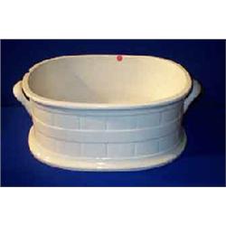 A BELLEEK WHITE POTTERY BARREL SHAPED FOOT BATH, SECOND PERIOD, (1891-1926), flanked by handles (...