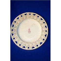 A BELLEEK "GREEK" PLATE, FIRST PERIOD, (1863-1891), with armorial crest heightened in gilt, trans...
