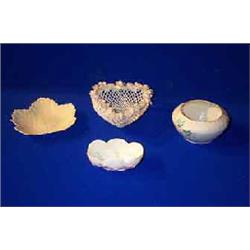 A COLLECTION comprising; a Belleek first period small scallop shell bon bon dish; a first period...