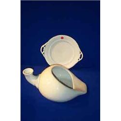 A BELLEEK BED PAN, FIRST PERIOD, (1863-1890), black printed mark; and a first period cake plate,...