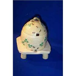 a belleek "grass honey pot and cover", second period, (1891-1926), the basket weave moulded hive,...