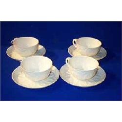 a set of four belleek "institute ware" breakfast cups and saucers, first period (1863-1890), blac...