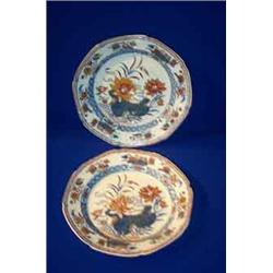 A PAIR OF CREAMWARE PLATES, EARLY 19th CENTURY, IN IMARI STYLE, each signed Donovan,, 21cms dia...