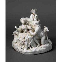 A VIENNA white PORCELAIN GROUP, 18th century, of shepherds, shepherdesses and animals cavorting a...