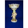 Image 1 : A GERMAN CENTREPIECE, LATE 19th CENTURY, the form of amorini disporting a rose clad palm bough ho...