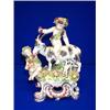 A DUESBURY DERBY GROUP, c.1800, of bacchic amorini, the children garlanded with fruiting vine and...