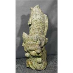 A LARGE ORIENTAL STONE CARVING OF AN UPRIGHT CARP,, 136cms high., €2000/3000, Illustration...