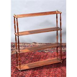 A SET OF MAHOGANY HANGING WALL SHELVES, c.1790, on spindle supports and with brass urn finials<br...