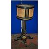 Image 1 : AN EBONISED AND PARCEL GILT JARDINIERE, c.1840, the caned and fluted top with a zinc liner, flute...